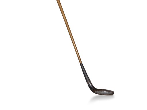 A golf putter with a silver club and a bronze handle.