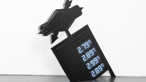Artwork showing a black banner that lists fuel prices in bright blue color