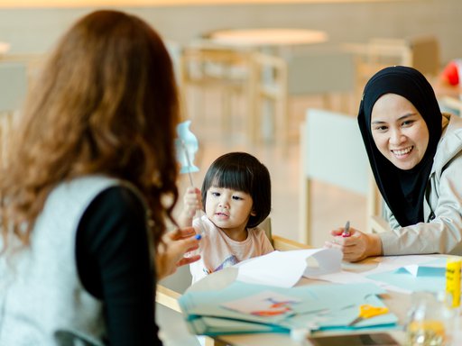 A mother and her child attend a workshop