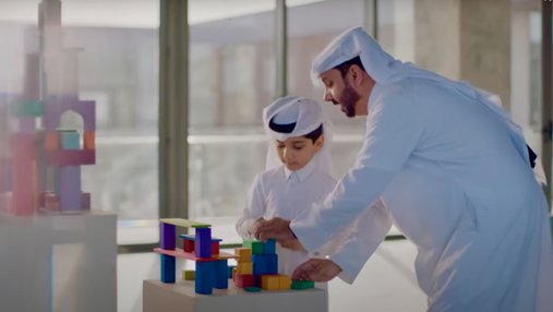 A Qatari father and son play at Dadu, Children's Museum of Qatar