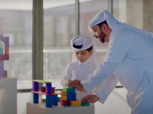 A Qatari father and son play at Dadu, Children's Museum of Qatar
